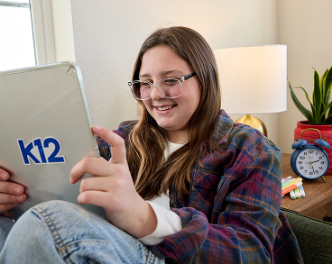 Student reading with her laptop